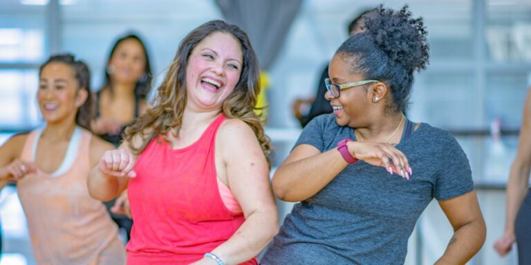 Two women dancing in an exercise class
