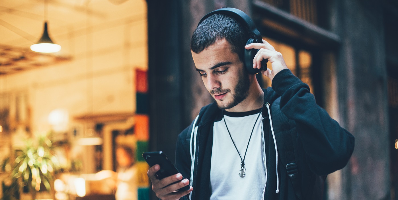 Man listening to audio on headphones